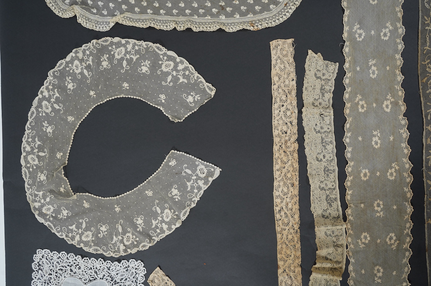 An early 19th bobbin lace length and a Brussels needle lace length, a Brussels bobbin lace wedding hankie and Brussels collar and length of trimming, a needle run collar and similar stole. (7). Brussels bobbin trim 250cm